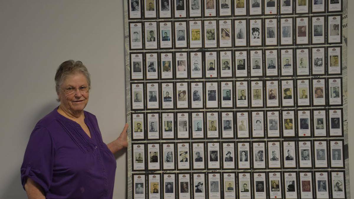Jan James with her photo exhibition at the Northam RSL Memorial Hall. Photo: Timothy Williams. 