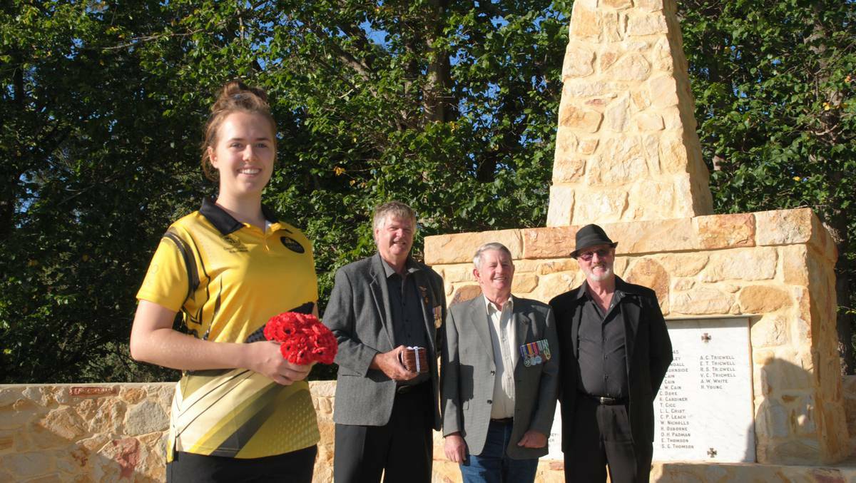 Emily Fernley at the Donnybrook war memorial with RSL members Geoff Box, Daryl Endersbee and Ric Evans. Photo: Nina Smith.