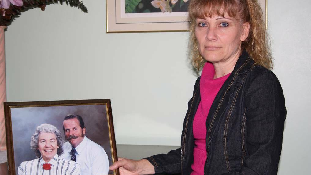 Karen Ferguson with a photo of her late father, Lindsay.