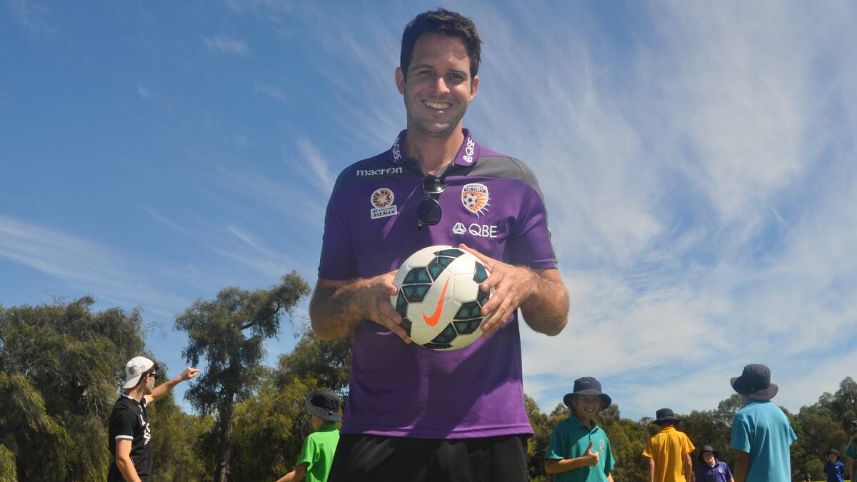 Soccer glory: Callum Salmon and young players visited the school to conduct a clinic.