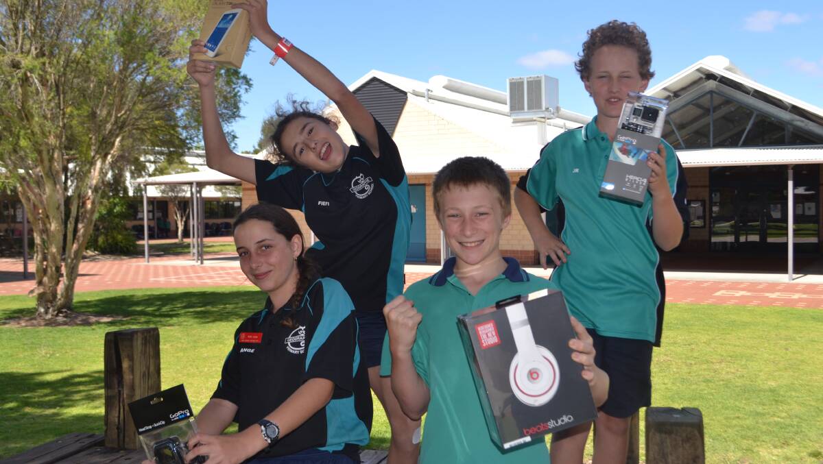 Festival silver and bronze: Bella, Sophie, Lachlan and James celebrate their wins with their new gadgets.