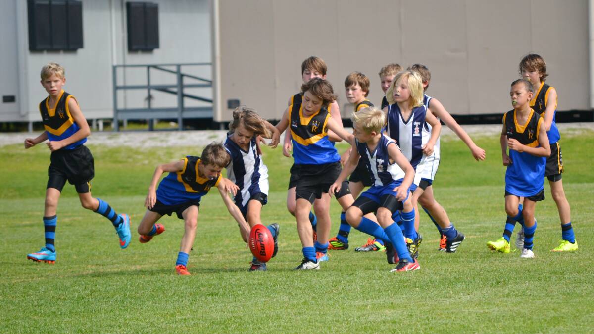 Vasse player Angus Telchadder about to make another clearing  dash from defence.