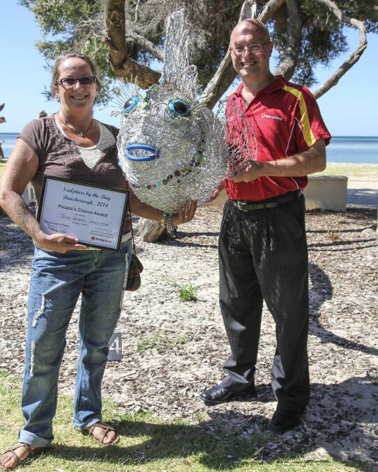 2014 Bendigo Bank’s People’s Choice Award Winner: Trish Waters was presented the award for her Fancy Fish sculpture by Dunsborough Community Bank branch manager Tom Schaberau on Monday. 