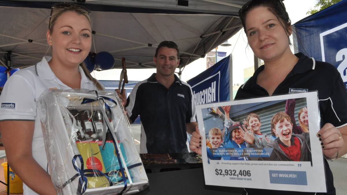 Fundraising fun: Harcourts marketing co-ordinator Brittany Snelgar with Busselton Harcourts owner Craig Edwards and Busselton marketing co-ordinator Jodie Moore. 