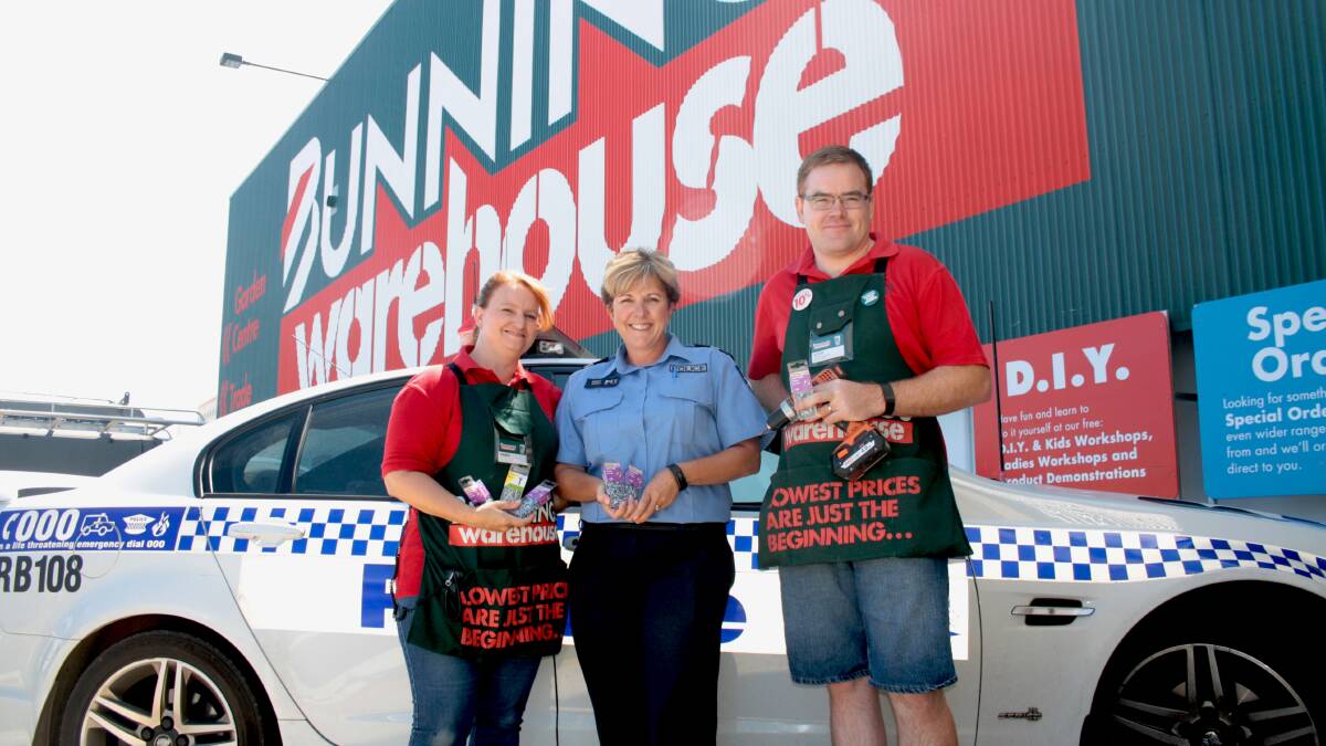 South West crime prevention officer Senior Constable Steph Smith with Bunnings Bunbury employees Karen Giles and Scott Nayda who are preparing to fit anti-theft screws to local numberplates for free on Saturday.