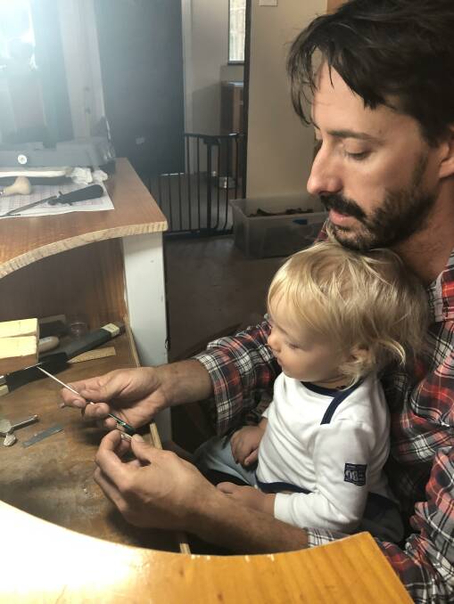 Luke Jessop creating jewellery with his son.
