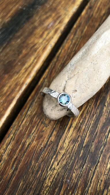 A Saltwater Sapphires creation made with an Australian sapphire and a cuttlefish casting.
