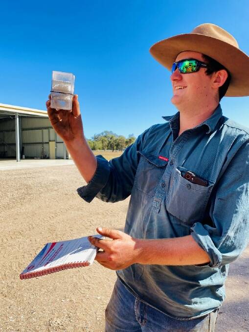 Geographe farmer James Scott testing fertiliser in a granule separator to determine particle size. 