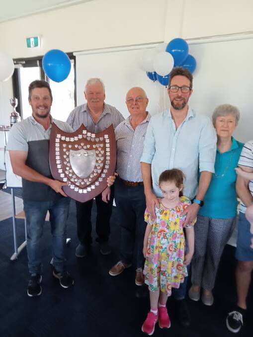 TON UP: Alistair McIlroy, left, from Margaret River Hawks Cricket Club accepts the Yates Shield from Barry House, David Yates, Mike and Hannah Yates and Jenny Yates. Photo supplied.