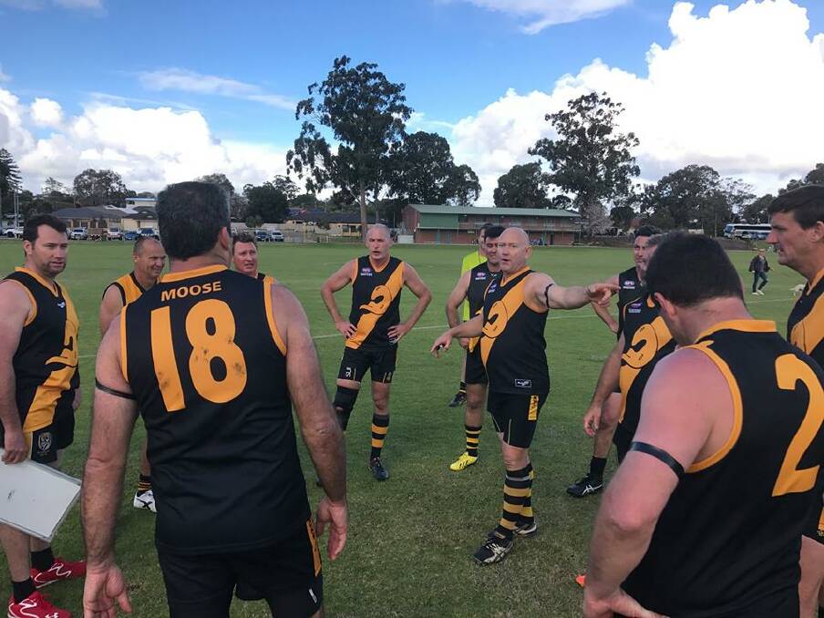 Listen up boys: Dunsborough Ducks in the huddle. Photo: supplied.