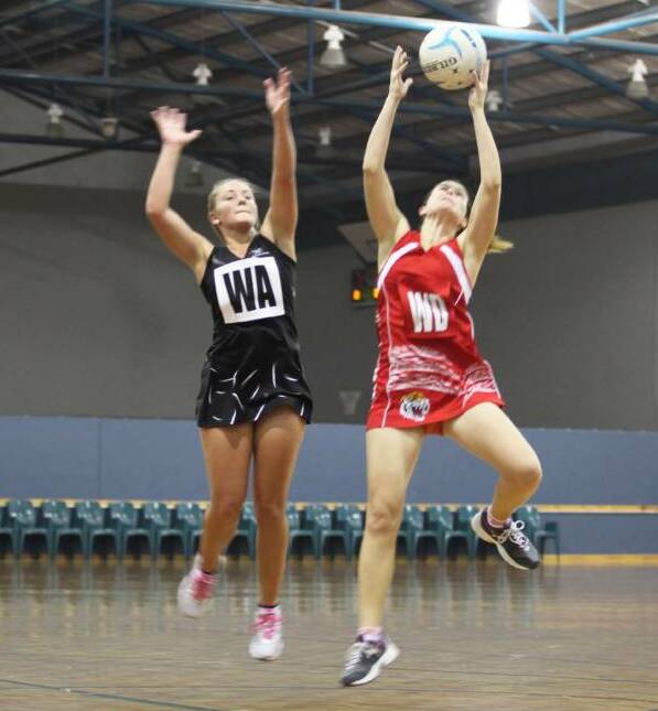 IN FLIGHT: Busselton netballer Taylah McKay, pictured playing against South Bunbury last year, hopes to help lift her side to success in season 2016. 