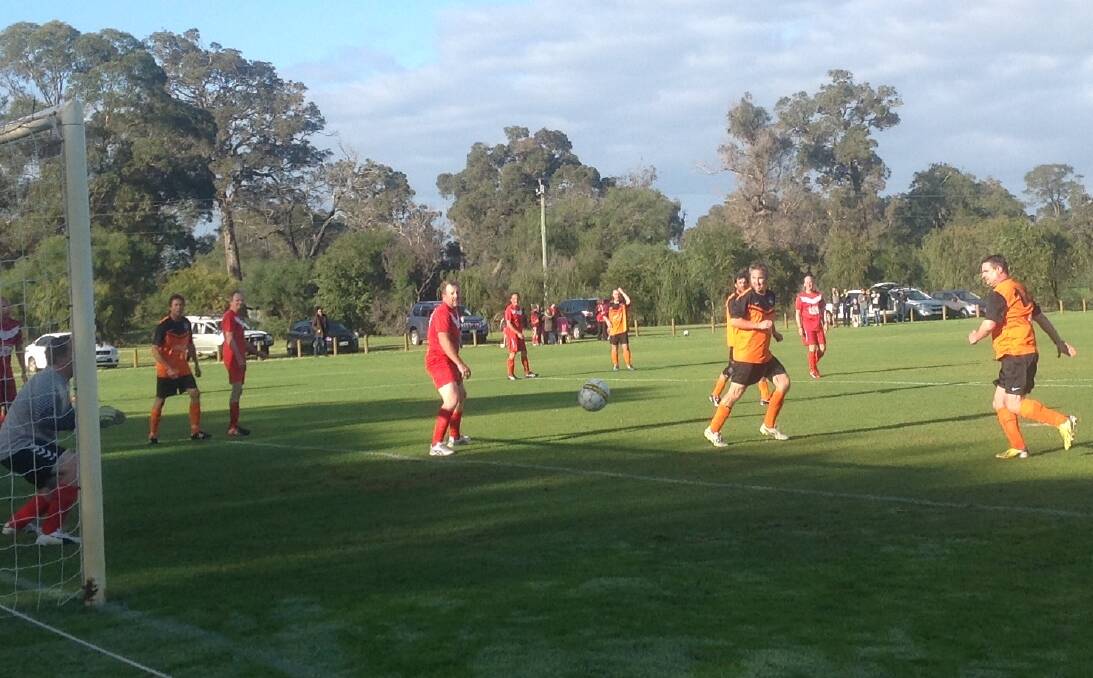 Attack: Geographe Bay's Maurice Krakowczyk shoots for a goal. The team versed Busselton City in a derby, after having a three-week break, and won the match nine points to one. Photo: Rose Williamson.