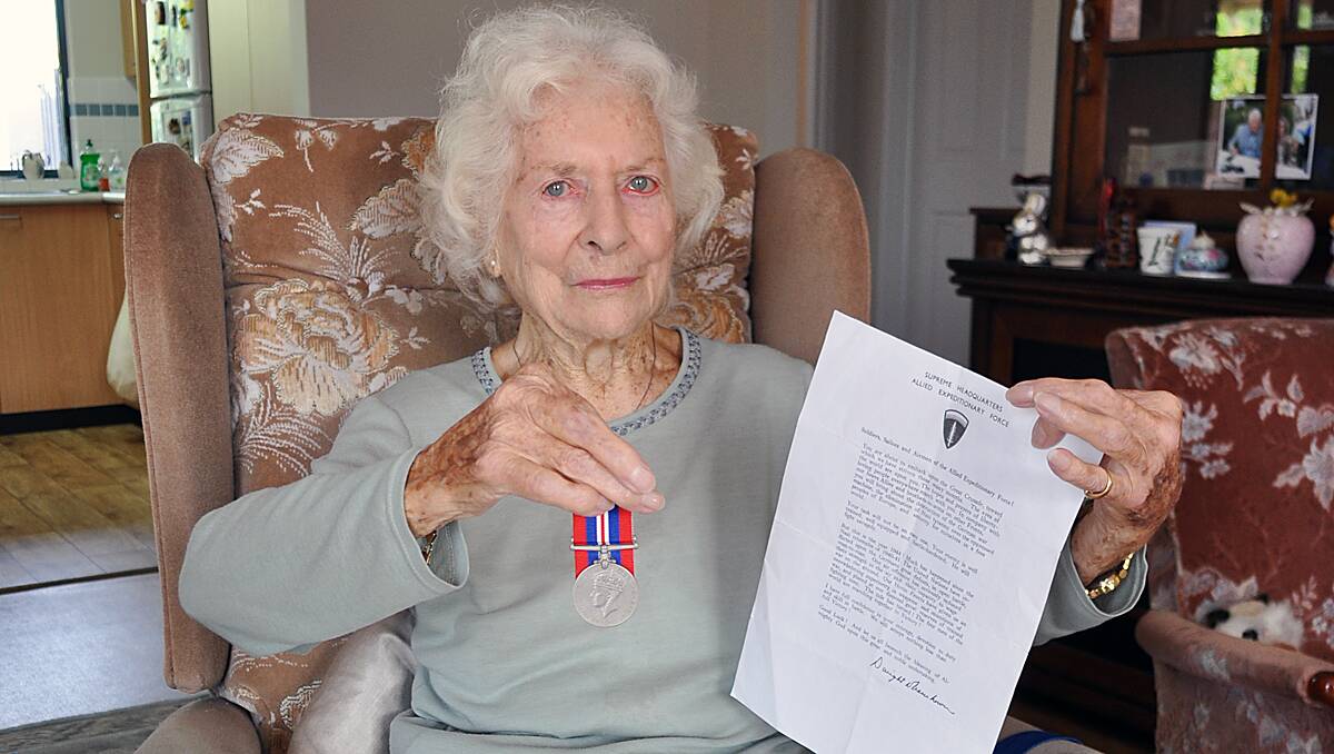 Brenda Edwards, who gave up a dream of working in fashion to drive lorries for the Women’s Auxiliary, with her medals and letter from Dwight D Eisenhower.