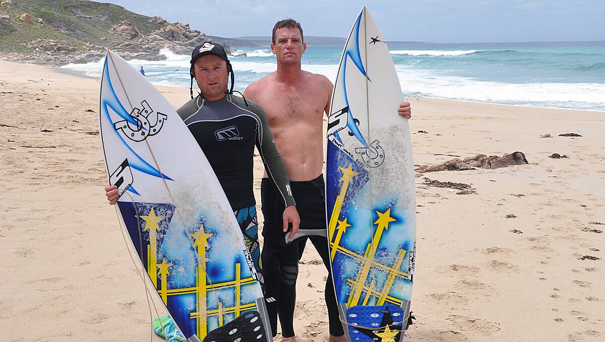 Surfers Scott Eves and Pete Knight back at the scene of their close encounter with a shark.