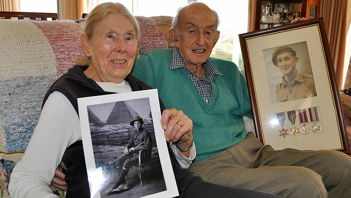 Jean with a photo of her father at Gallipoli, and Frederick with his war medals and a photo of him taken during WWII.