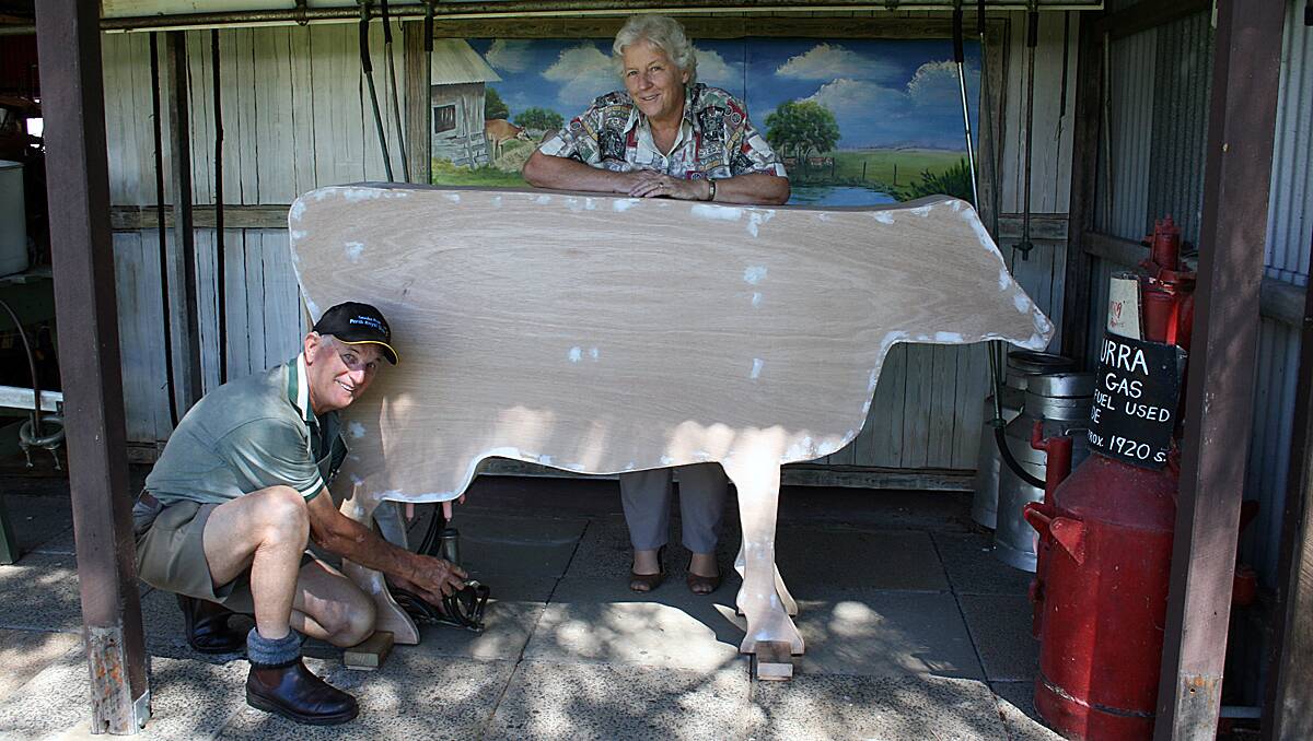 Elwyn Harries and Rhonda Bartlett with the cow Elwyn created for the Old Butter Factory.