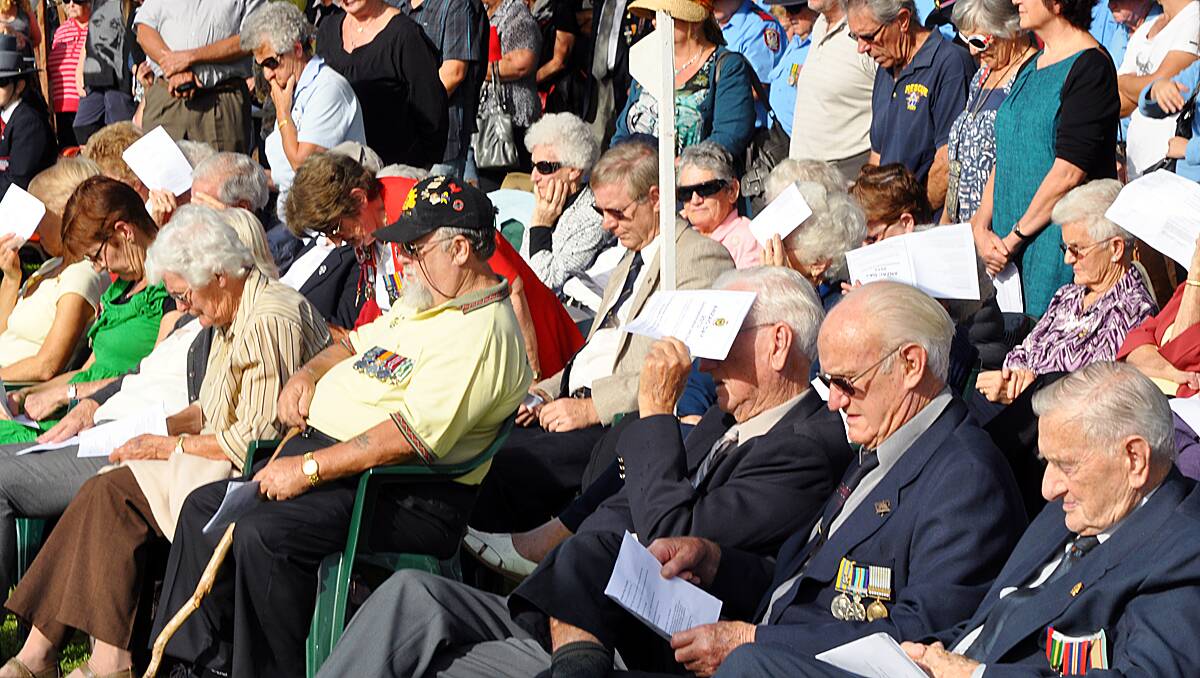 Can you spot any familiar faces in the crowds at the Busselton Anzac day service?