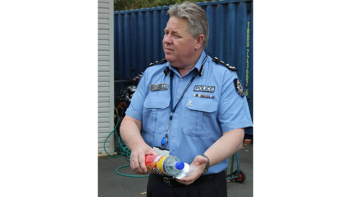 State Commander for Leavers 2013 Murray Smalpage with a confiscated pringles can which contained a water bottle full of vodka.