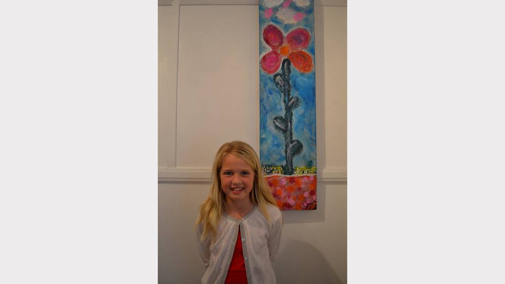 Lucinda Jones, 9, with her beautiful artwork titled New Life.