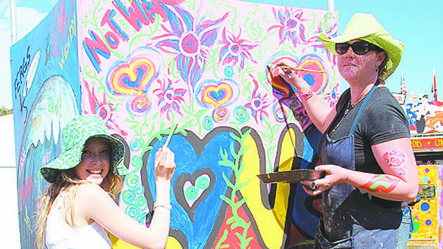 2006: Actress Emma Booth and friend bring some colour to the festival 