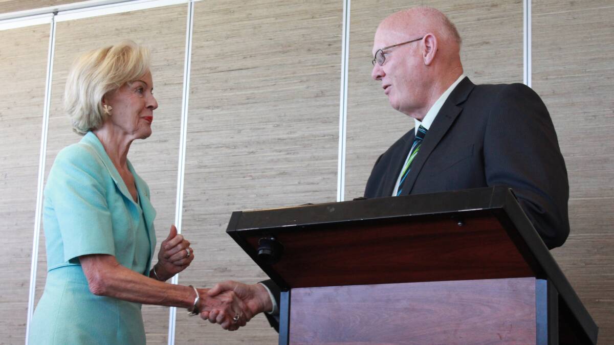 The Governor General of Australia Quentin Bryce receiving a present from City of Busselton Mayor Ian Stubbs.