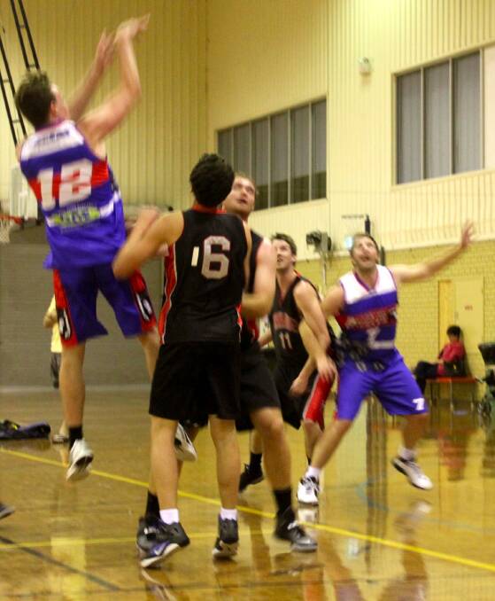 Liam Kelly going for the jump shot.
