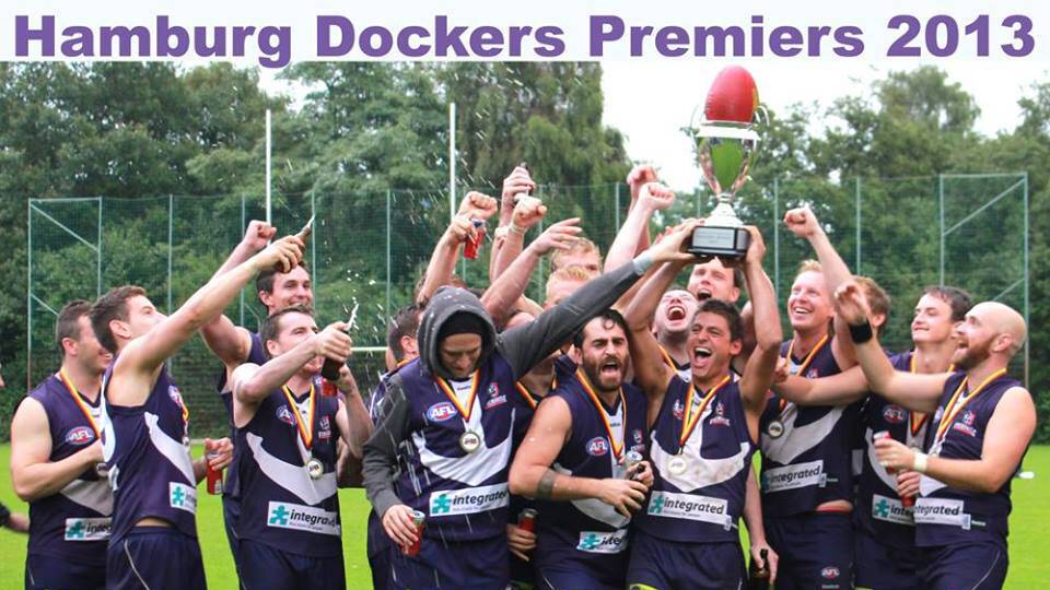 Bunbury man Casey Woodward captained the Hamburg Dockers to their first flag last weekend in the Australian Football League Germany competition. He is pictured holding the cup with his team mates. Photo courtesy of J Mancuso.