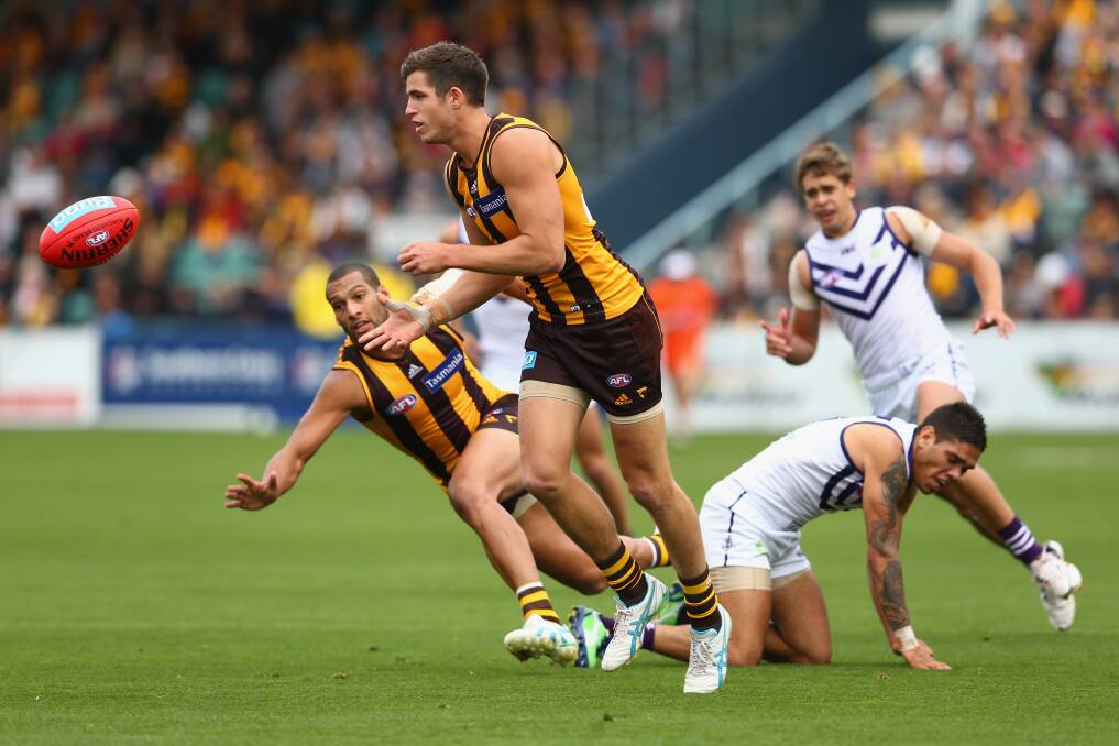 Ben Stratton charges on as other players fall around him when Hawthorn last met Fremantle. Photo: Getty Images.