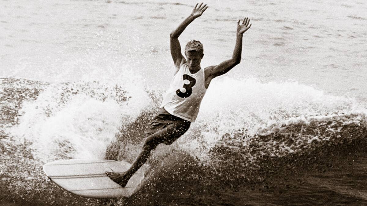 SURFS UP: The iconic photo of Midget Farrelly the statue mock up was based on. Photo: Perrott