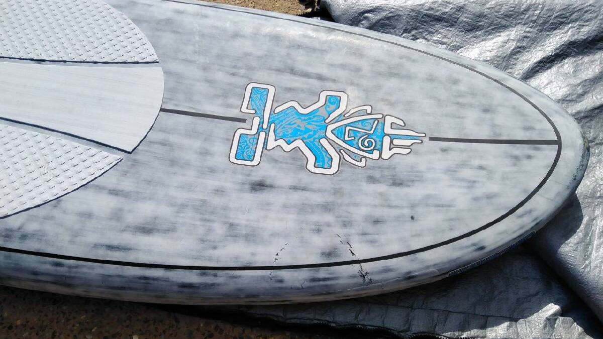 The shark bite marks left in Gary May's paddleboard. Photo by Jim King.