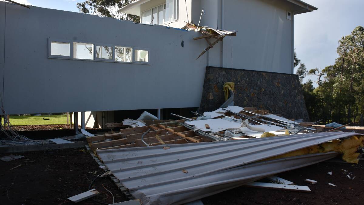 A home in Eagle Bay lost its roof during Monday morning's storm, which residents described as a tornado that ripped through parts of the seaside community. 