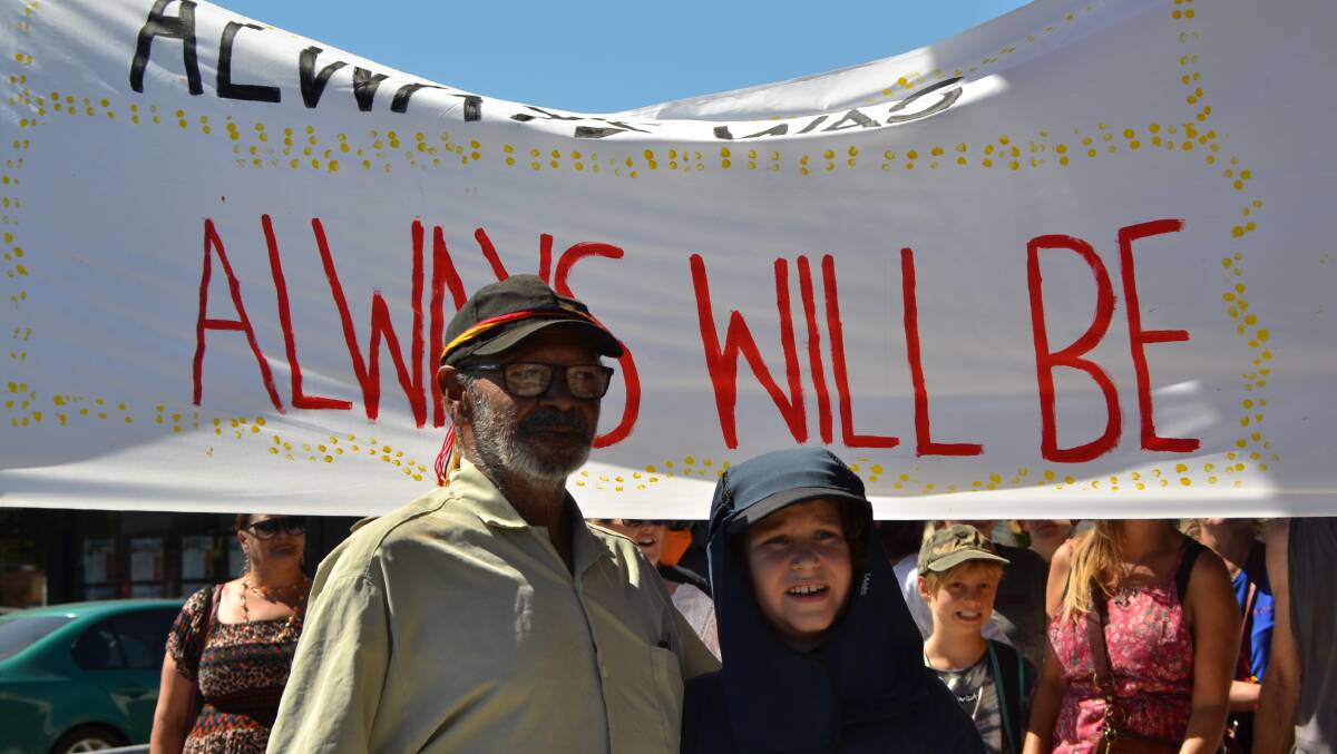 Always was: Wardandi elder Bill Webb and his grandson Tyler Webb, led the peaceful walk down Queen Street in recognition of the painful history. Picture: Brianna Melville