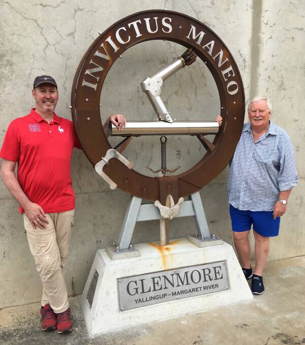 'Unvanquished': The Armstrong family crest at Glenmore Winery, with Barry House AM, and sculptor Ian Bell. Picture: Supplied.