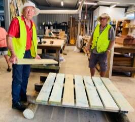 Laurie Brooker and David Monotti from the Dunsborough Mens Shed rebuilt the bridge under the direction of shed supervisor, Murray Mills. Picture: Supplied.