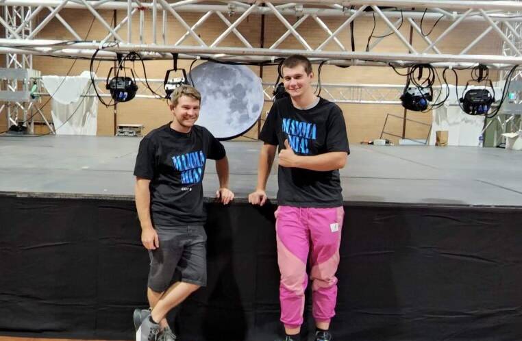 Jacob Arnold and Jake Sheedy prepare the set for Mamma Mia! the musical. Picture: Supplied.