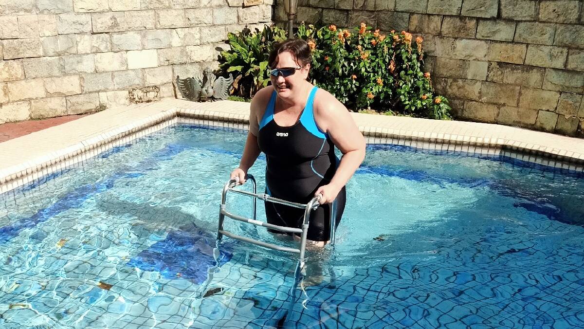 Re-learning: It took Yanti Ardie weeks to learn how to swim again after an infection damaged every structure in her body. Picture: Supplied.