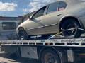 Car belonging to a 48-year-old accused of doing a burnout in front of police is towed from Noble Park, Melbourne. Picture supplied