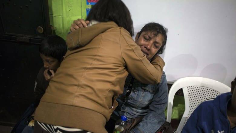 Ruth Rivas, who has two missing children, is consoled by a neighbor in a shelter near Guatemala's Volcan de Fuego. Photo: AP