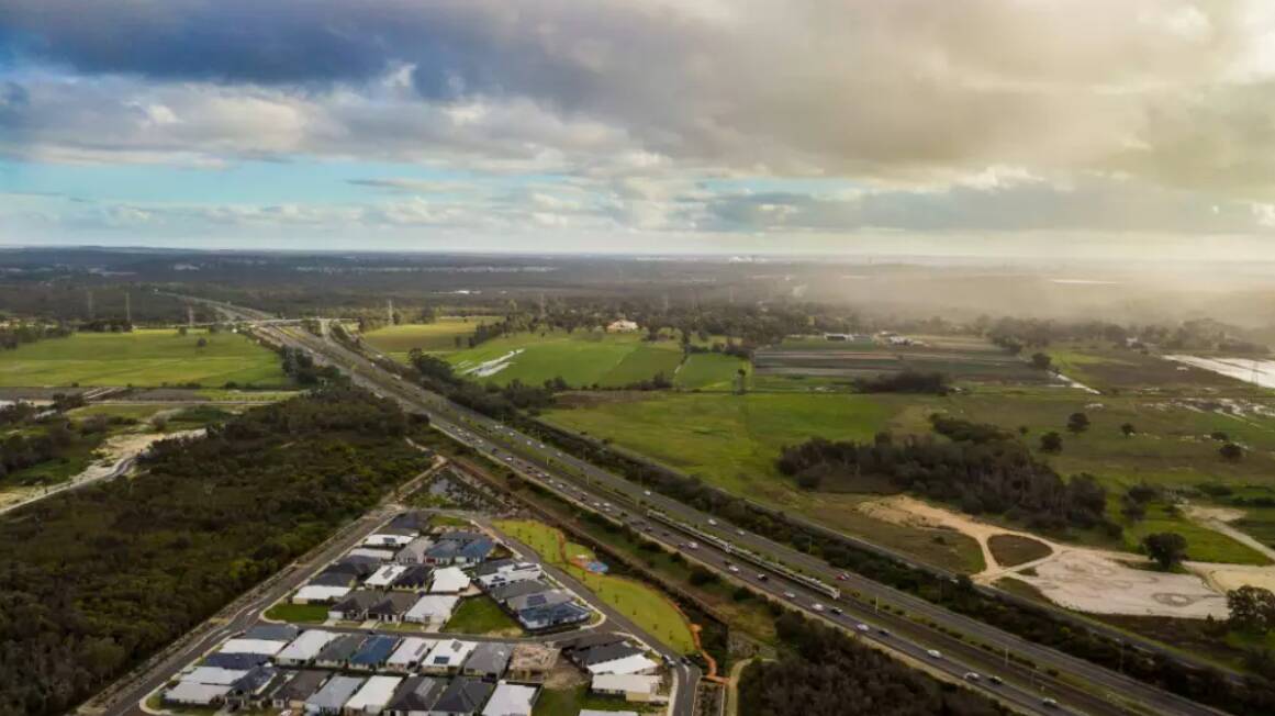 The City of Kwinana looking southwest from Wandi, with the Kwinana Freeway running south through the middle of the frame and the Kwinana industrial area in the distance. Under the framework the industrial area will extend from Rockingham in the south to the city of Cockburn in the north. Photo: Hamish Hastie