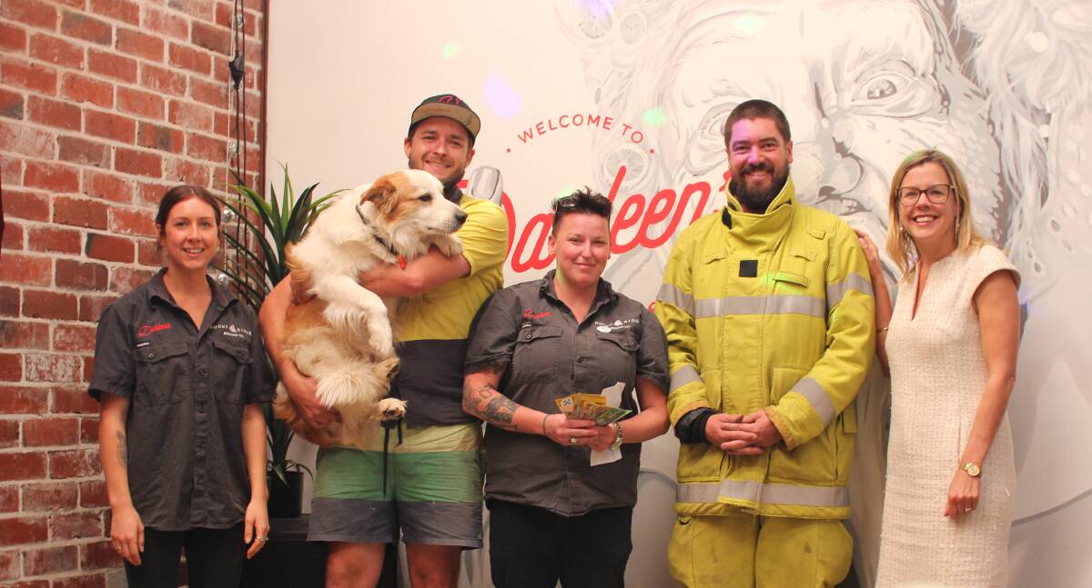 Community spirit: Darleen's Taphouse staff hand over $1,000 to Busselton Volunteer Fire and Rescue lieutenant Mark Box, courtesy of its generous staff and customers. Photo: Jesinta Burton.