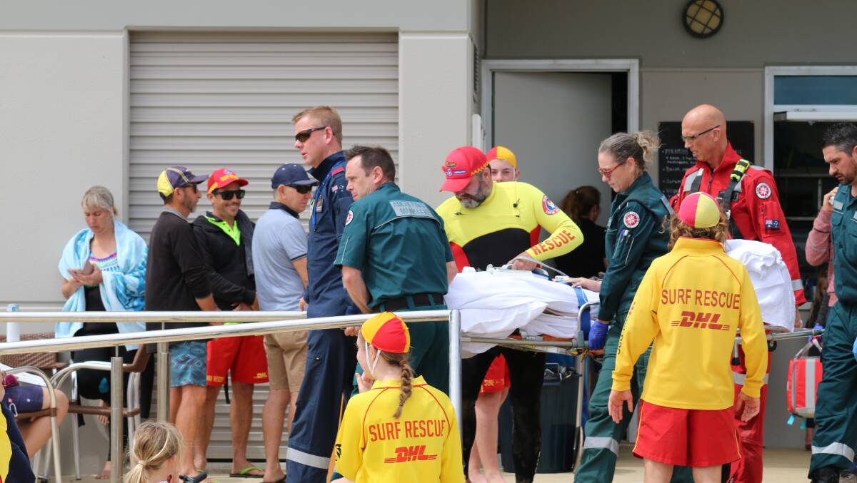 Paramedics attended to him when he was removed from the water. Photo: Caitlyn Rintoul/Fairfax Media.