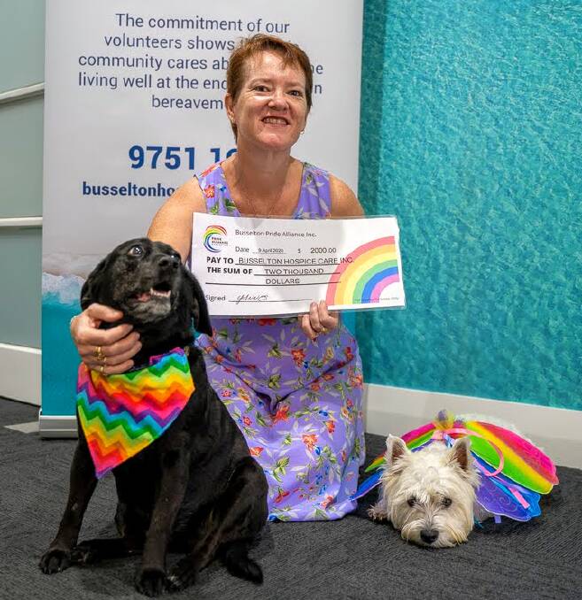 Busselton Hospice Care Inc chief executive officer Rosie Brown received a donation from Busselton Pride Alliance's Rainbow Dog Walk. Image supplied.