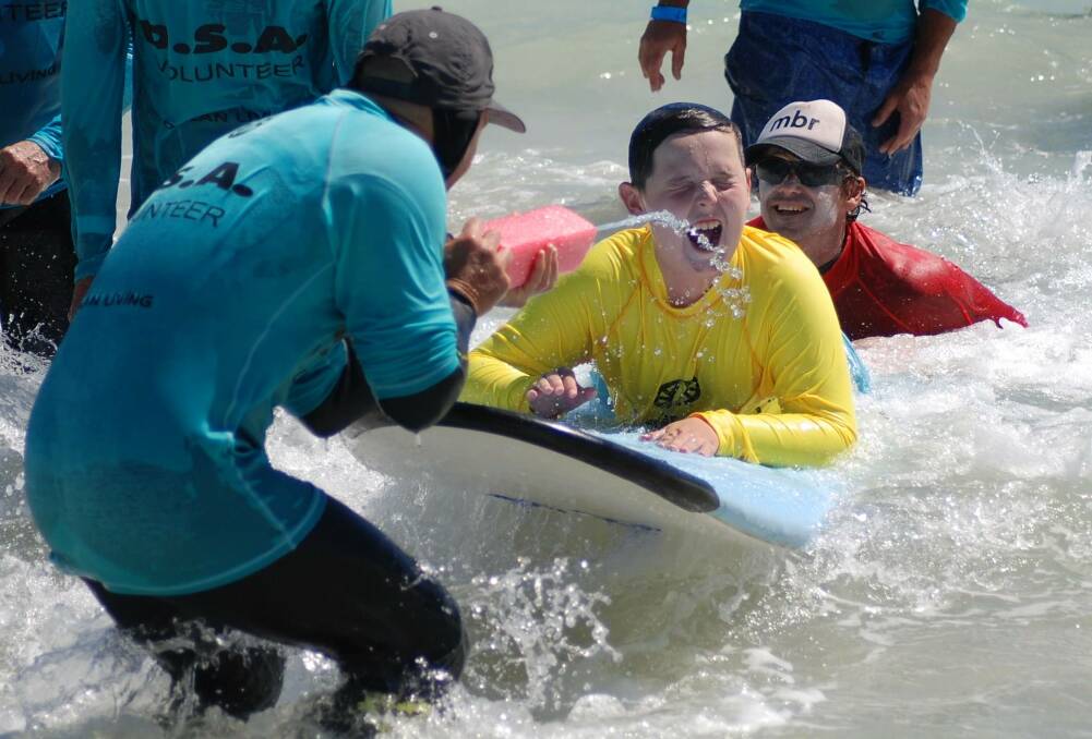 Surfer Jarvis Gibbons catching waves at Bunker Bay with the Disabled Surfers Association South West. Image supplied.