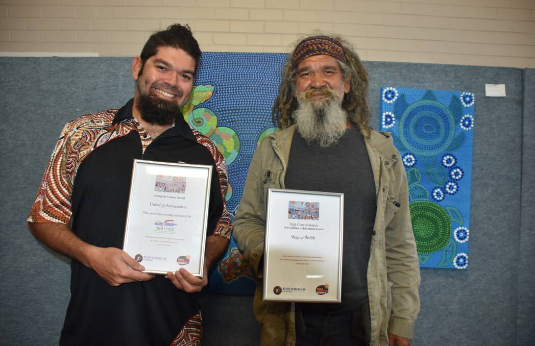 Undalup Association cultural custodians Iszaac and Wayne Webb with their awards for caring for country and lifetime achievement.