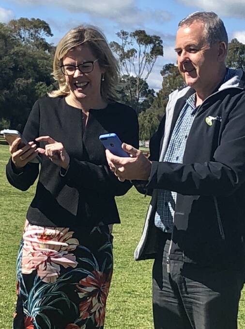 Vasse MLA Libby Mettam and Telstra area general manager Boyd Brown testing the signal at Sir Stewart Bovell Oval. Image supplied.