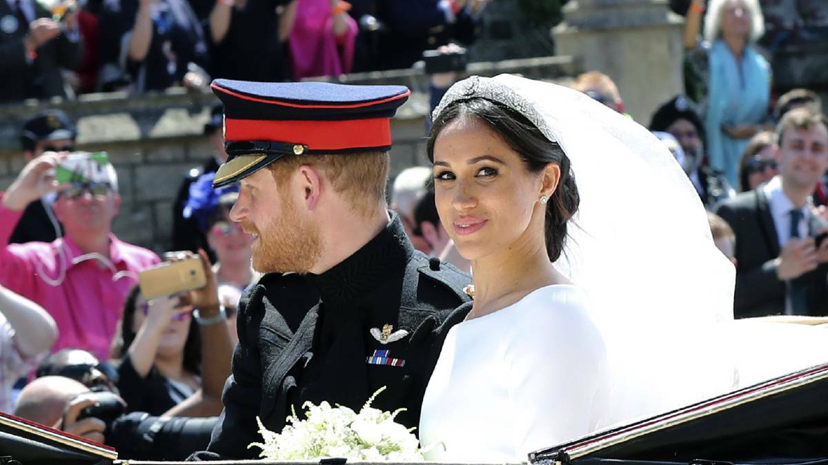 Britain's Prince Harry and his wife Meghan Markle leave after their wedding ceremony, at St. George's Chapel in Windsor Castle in Windsor, near London, England, Saturday, May 19, 2018. (Gareth Fuller/pool photo via AP).