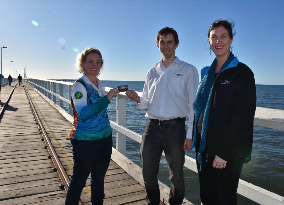 Busselton Jetty acting chief executive Amy Gornall, City of Busselton councillor Ross Paine and jetty treasurer Jessica O'Malley.