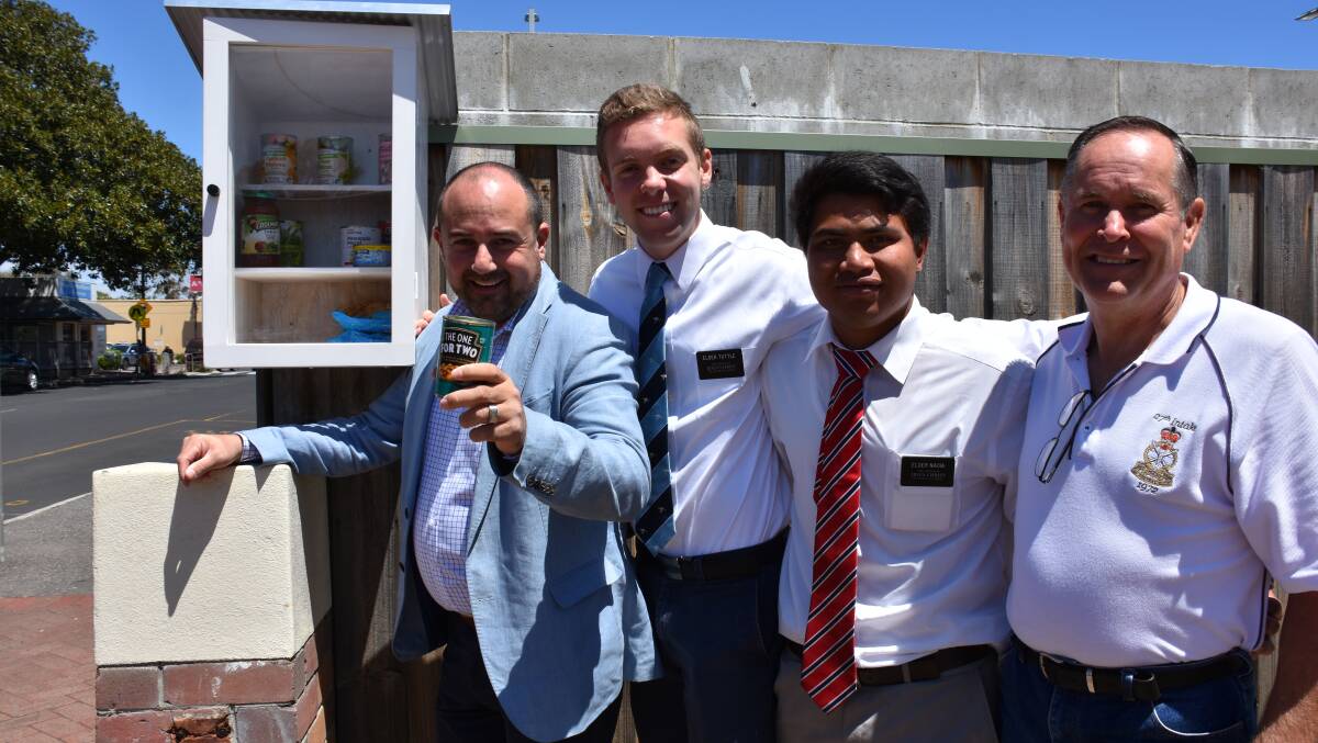 Church Of Jesus Christ Of Latter Day Saints members Justin Geracitano, Elder Tuttle, Elder Naoia and Brenton Pettigrove at the food box located at 69 Kent Street, Busselton next to the Woolworths car park.