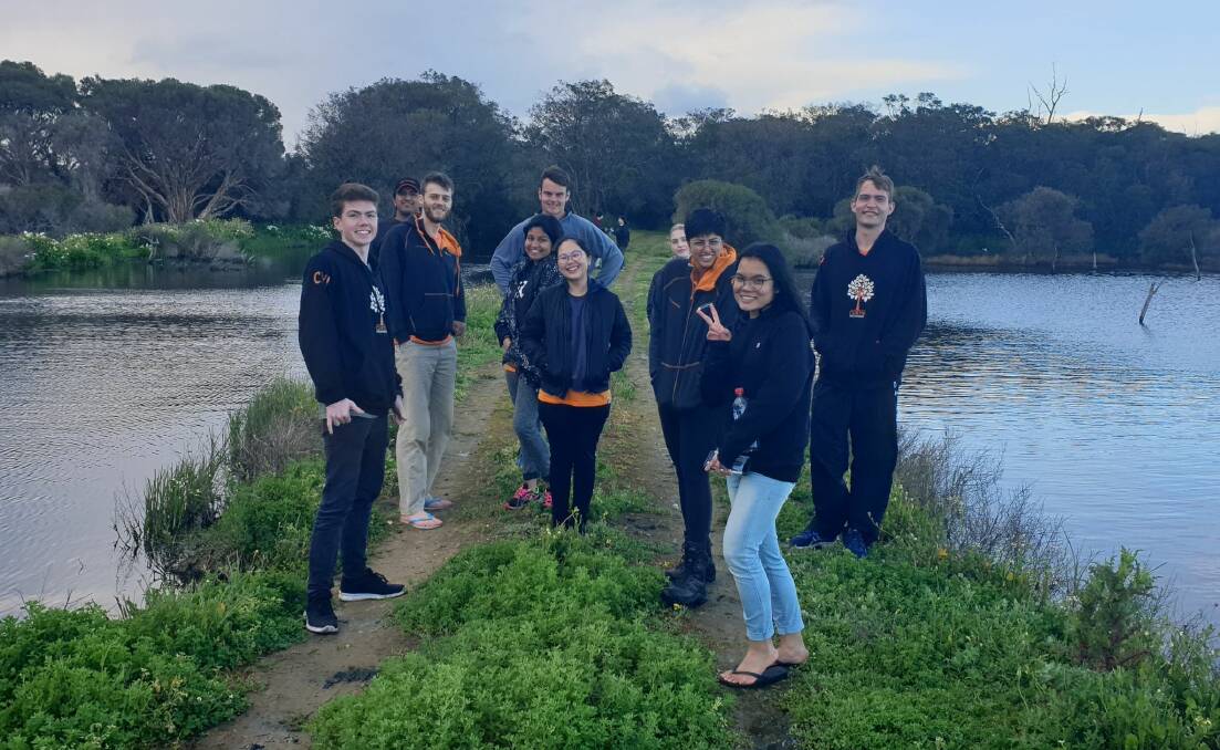 A team of volunteers from Curtin University in Perth travelled to Busselton to help the Vasse Scouts spruce up their campground at Siesta Park. Image supplied.