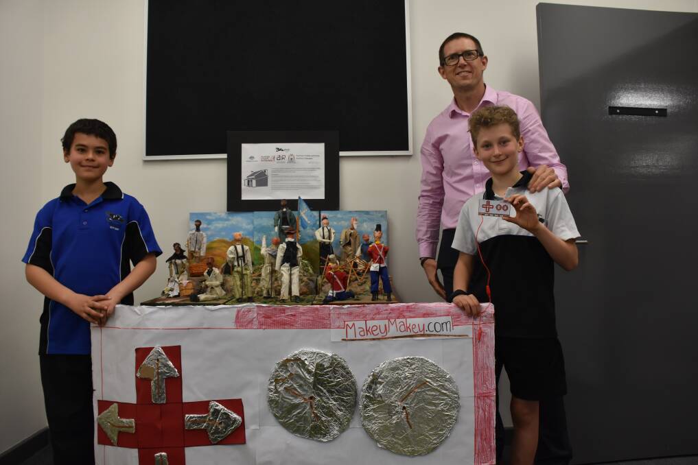 Vasse Primary School year five students Jacob and Kai with assistant principal Simon Mansfield and projects students have completed through the STEM program.